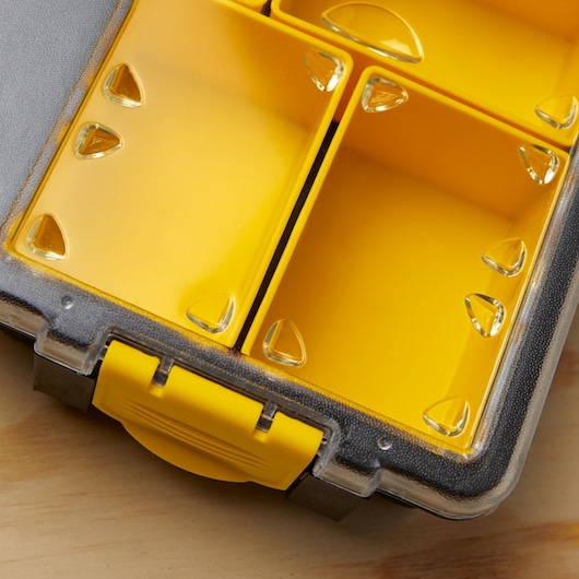 STANLEY SKU 014725R yellow plastic organizer with clear lid and divided compartments, close-up angle.