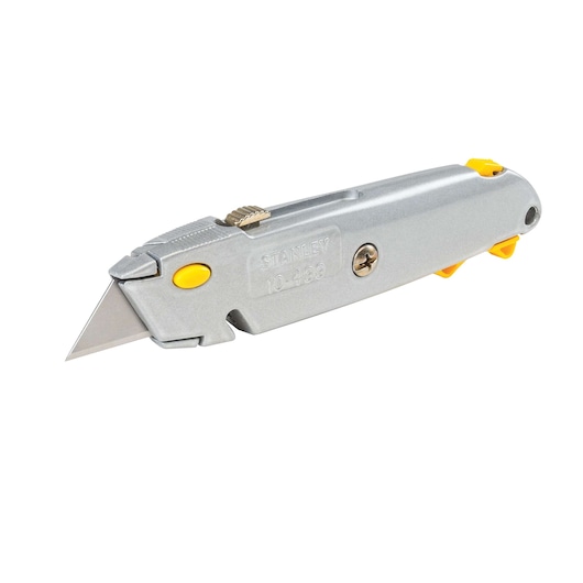 Stanley utility knife with silver metal body, yellow accents, and exposed blade, angled right on white background.