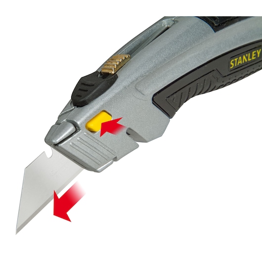 Stanley 10-788 utility knife close-up, silver body with yellow button, blade partially extended.