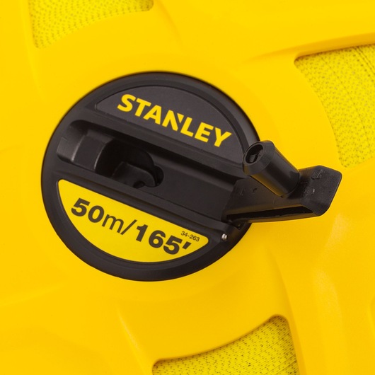 Photo of STANLEY 34-263 yellow and black tape measure reel, close-up showing 50m/165ft marking and handle.