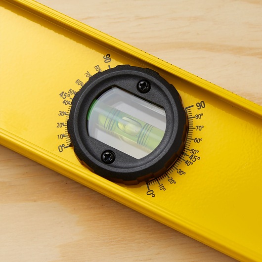 STANLEY 42-324 yellow spirit level with protractor vial, close-up showing angle markings.