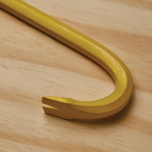 STANLEY 55-118 yellow steel pry bar close-up on wood surface.