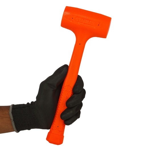 Photo of STANLEY 57-531 orange dead blow hammer held in a gloved hand, front angle, white background.