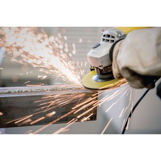 STANLEY STA0413 angle grinder in use, close-up with sparks flying while grinding metal.